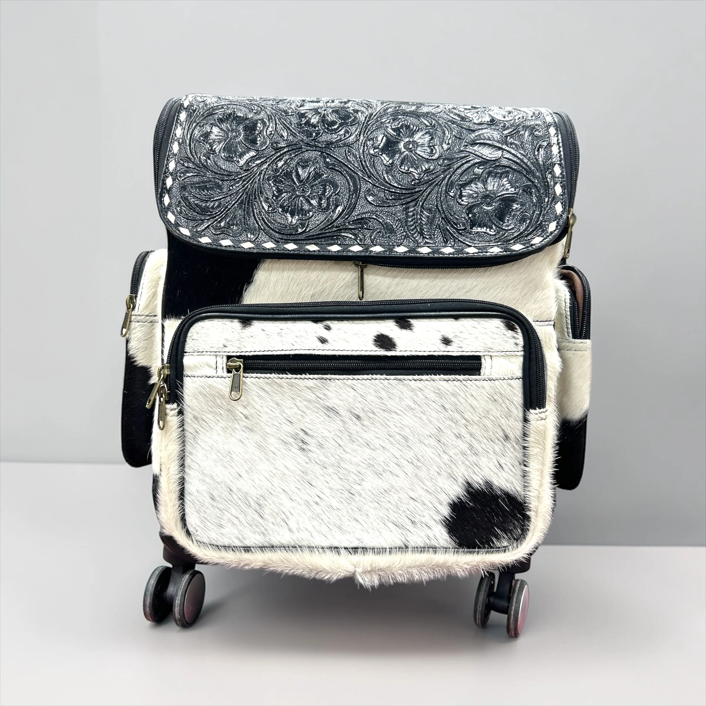 Black tooled leather & cowhide rolling backpack